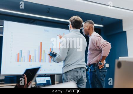 Two business people collaborating on a project for corporate success Stock Photo