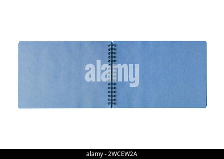 Open spiral bound notepad with two craft blue sheets, isolated on white background. Top view, copy space for text, template, mockup Stock Photo