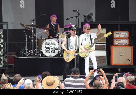 Cheap Trick performing in Sherman Texas, during what would become a rain shortened concert, July 3, 2023. Daxx Nielsen, Robin Zander and  Tom Petersso Stock Photo