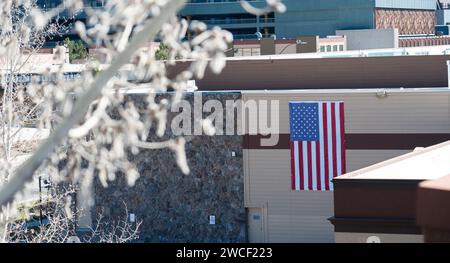 American flag hanging on side of building. Stock Photo