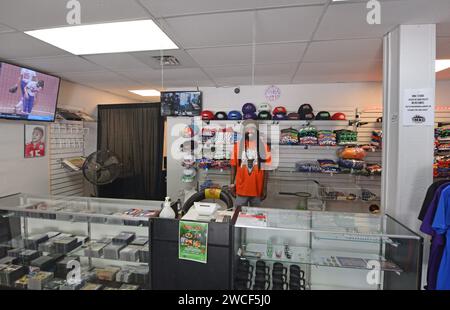 Rastafarian man in a clothing and baseball cap store in the historic 18th and Vine District in Kansas City Missouri - May 2023 Stock Photo