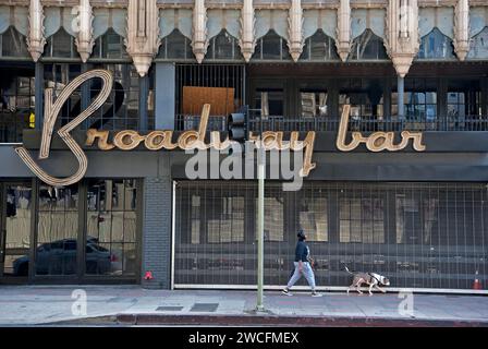 Downtown street scene with sign for the Broadway Bar and art deco architectural details in Los Angeles, California, USA Stock Photo