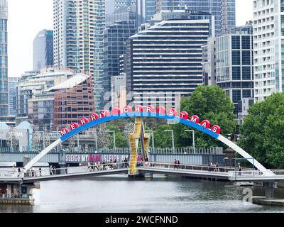 View of Evan Walker Bridge over the Yarra River in Melbourne, Victoria, Australia with a large festive Merry Christmas greeting Stock Photo