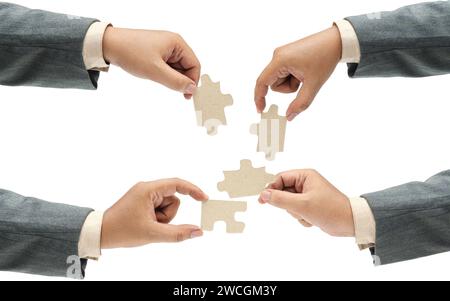 Collection of business hand holding a single piece of puzzle isolated over white background. Teamwork and partnership concept Stock Photo