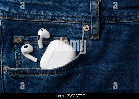 Antalya, Turkey - January 15, 2024: White wireless headphones Apple AirPods 3 Stock Photo