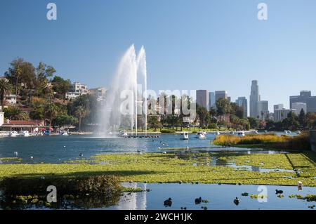 LOS ANGELES, CA, USA – OCTOBER 29, 2022: Echo Park lake with Swan boats, and downtown Los Angeles skyline in background Stock Photo