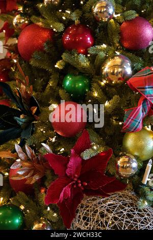 A festive Christmas tree adorned with various ornaments Stock Photo