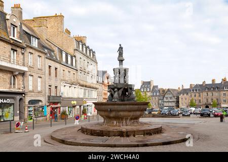 Guingamp, France - May 04 2022: The Plomée fountain is a fountain located in Guingamp at the top of the Place du Centre, at the intersection of rue No Stock Photo