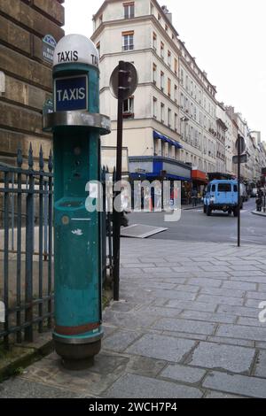 Paris, France - September 20 2017: Green Taxi call box (known as Borne d'appel de taxi in France) near the Church of Notre-Dame-de-Lorette in the 9th Stock Photo