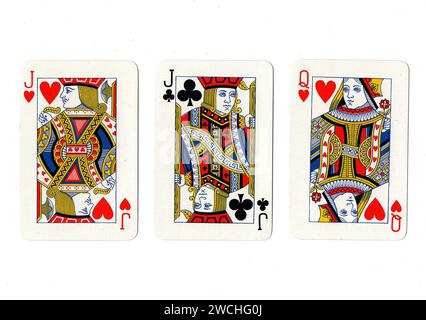Vintage playing cards showing a pair of jacks and a queen isolated on a white background. Stock Photo