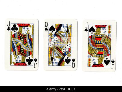 Vintage playing cards showing a pair of black jacks and a black queen isolated on a white background. Stock Photo