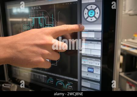 cnc monitor when displaying the program, the worker points with his ...