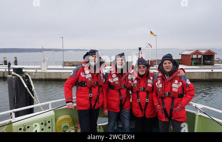 16 January 2024, Schleswig-Holstein, Laboe: The volunteer ambassadors of the sea rescuers, the North German band 'Santiano' (l-r) Hans-Timm 'Timsen' Hinrichsen, Björn Both, Peter David 'Pete' Sage and Axel Stosberg, stand on board the rescue cruiser 'Berlin'. Last year, German sea rescuers from the German Maritime Search and Rescue Service (DGzRS) helped a total of 3,532 people on 1938 missions in the North and Baltic Seas. They had to rescue 103 people from distress at sea alone, as the DGzRS announced on Tuesday. (To dpa 'Sea rescuers help more than 3,500 people in the North and Baltic Seas' Stock Photo