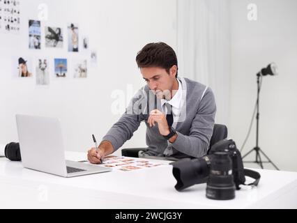 Photographer, working and editing with computer in office with technology, software and thinking. Professional, editor and creative person learning on Stock Photo