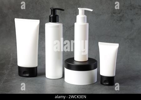 Skincare beauty products on dark marble background, set of cosmetics mock-up bottles and tubes for body care Stock Photo