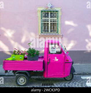 SIBIU, TRANSYLVANIA, ROMANIA - JULY 8, 2020: Decorative motor scooter with flowers, on one vintage street. Stock Photo