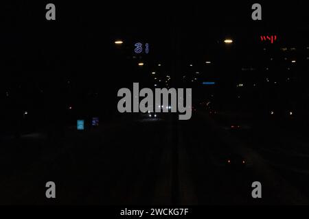 Beautiful night photo of a highway in Stockholm Sweden. Lights from cars and houses. Stock Photo