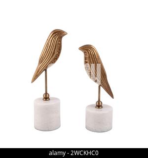 luxury decorative metal bird figures on marble isolated on white background Stock Photo