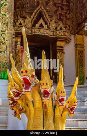 Seven-headed naga guarding the entrance to the Royal Palace Temple (Haw Pha Bang) built to house the sacred statue of Buddha in Luang Prabang, Laos Stock Photo