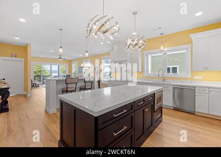 A spacious Kitchen with central island in Stock Photo