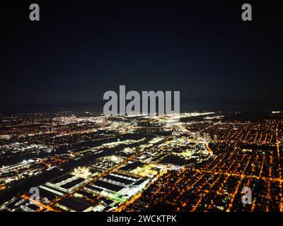 Aerial cityscape at night viewed from an airplane Stock Photo