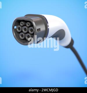 The official European AC charging connector for electric vehicles called IEC 62196 Type 2 on blue background. Selective focus Stock Photo