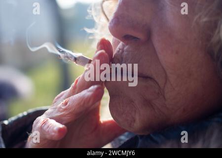Taking a drag on cigarette hi-res stock photography and images