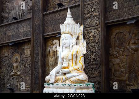 White Buddha statue at Gangaramaya Temple, it is one of the most important temples in Colombo, Sri Lanka Stock Photo