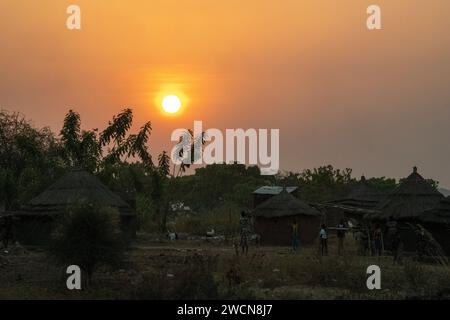 Uganda, Adjumani. South Sudan refugees in refugee camps line up for