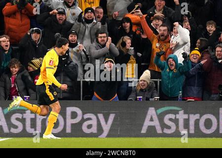 Wolverhampton Wanderers' Nathan Fraser celebrates scoring their side's second goal of the game in front of the home fans during the Emirates FA Cup third round replay match at the Molineux Stadium, Wolverhampton. Picture date: Tuesday January 16, 2024. Stock Photo