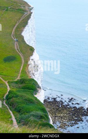 White cliffs of Dover, hiking trails, bay, people walking on paths along the cliffs with views of the sea and grassy areas, England, English Channel Stock Photo