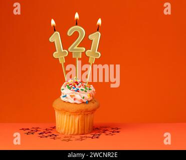 Birthday candle number 121 - Invitation card with orange background Stock Photo