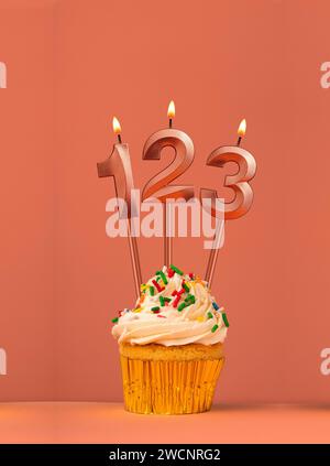 Candle number 123 - Cupcake birthday in orange background Stock Photo ...