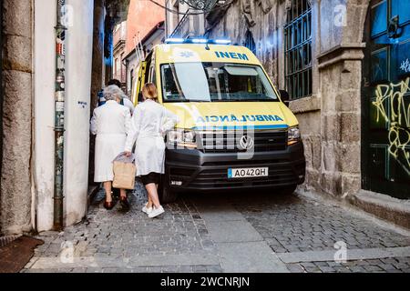 April 17, 2023, Porto, Portugal: Ambulance on the historic street in downtown Stock Photo