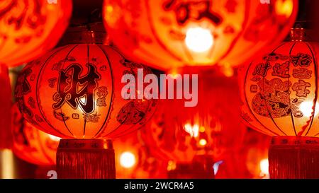 Traditional Chinese red lanterns hanging in the small alley. Stock Photo