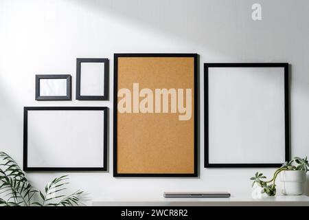 Set of black frames on white wall with copy space Stock Photo
