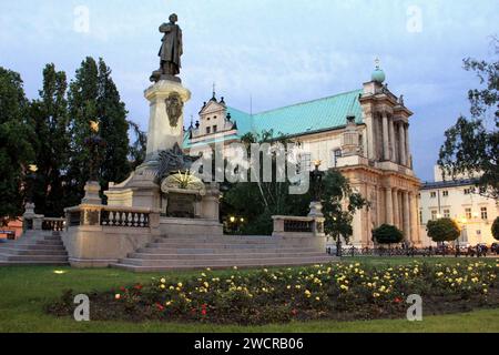 Adam Mickiewicz Monument, unveiled in 1898, in the Srodmiescie district, view in early evening illumination, Warsaw, Poland Stock Photo