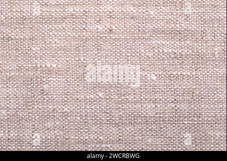 Linen fabric, surface, from above. Textile made from the fibers of the flax plant. Linen is very strong and absorbent and dries faster than cotton. Stock Photo