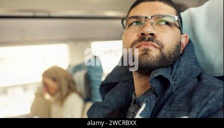 Thinking, idea and young businessman on a train for public transportation to work in the city. Reflection, planning and professional male person from Stock Photo