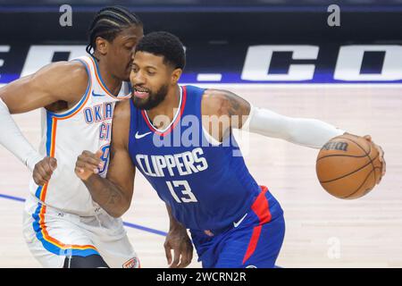 Los Angeles, United States. 16th Jan, 2024. Los Angeles Clippers' Paul George (R) drives against Oklahoma City Thunder's Jalen Williams (L) during an NBA basketball game at Crypto.com Arena. Final score; Clippers 128:117 Thunder Credit: SOPA Images Limited/Alamy Live News Stock Photo