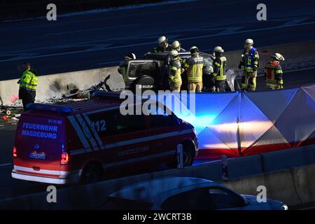 17 January 2024, Saxony-Anhalt, Magdeburg: Firefighters stand at the scene of an accident on the A2 freeway. A 78-year-old wrong-way driver was killed in an accident there on Wednesday morning. Another person was seriously injured, according to the police. The man had driven onto the highway in the wrong direction. On the carriageway towards Hanover, his car then collided head-on with a van and hit another vehicle. The wrong-way driver died at the scene of the accident. One person in the van suffered serious injuries. Photo: Klaus-Dietmar Gabbert/dpa - ATTENTION: Parts of the image have been p Stock Photo