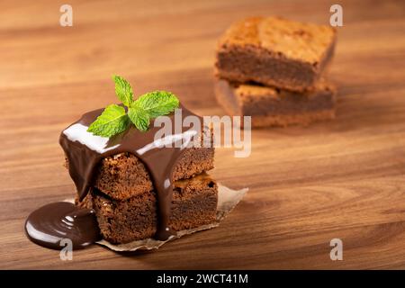 Pieces of chocolate brownie on the table. Stock Photo