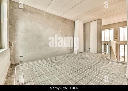 the inside of a building under construction with pipes in place to be used for heating water and air conditioning systems Stock Photo