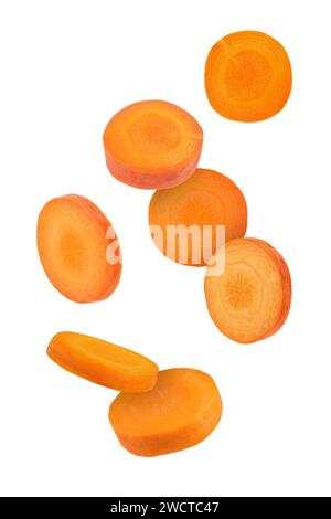 Fresh carrot slices falling on white background Stock Photo