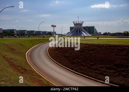 BRASILIA DF BRAZIL - NOVEMBER 26 2023: An urban landscape of Brasília, with streets and the cathedral with the blue sky in the background. Stock Photo