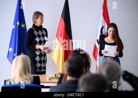 Berlin, Germany. 17th Jan, 2024. Gabriela Clarisse Marques Holzman (born in Brazil) receives a naturalization certificate from Sonja Fietz (l) at a naturalization ceremony at the Central Naturalization Office of the State Office for Immigration (LEA) in Berlin-Wedding. The centralization of all naturalization matters is intended to make naturalization procedures more efficient and accessible. Digital processes should make it possible to complete an individual application procedure within six months. Credit: Bernd von Jutrczenka/dpa/Alamy Live News Stock Photo