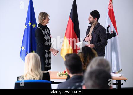 Berlin, Germany. 17th Jan, 2024. Mohamed Nafeh Kurdi (born in Syria) receives a naturalization certificate from Sonja Fietz (l) during a naturalization ceremony at the Central Naturalization Office of the State Office for Immigration (LEA) in Berlin-Wedding. The centralization of all naturalization matters is intended to make naturalization procedures more efficient and accessible. Digital processes should make it possible to complete an individual application procedure within six months. Credit: Bernd von Jutrczenka/dpa/Alamy Live News Stock Photo