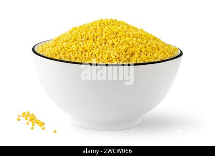 Bowl of raw yellow millet grains isolated on white background Stock Photo