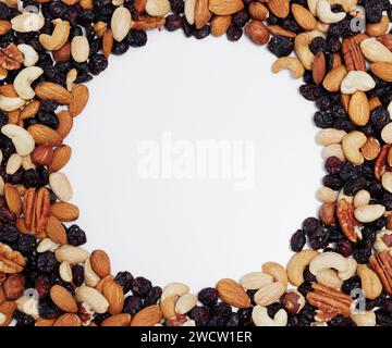 frame made of mixed nuts on white table background Stock Photo