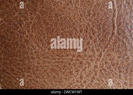 Brown worn leather surface, abstract background. Macro shot, top view, no people Stock Photo